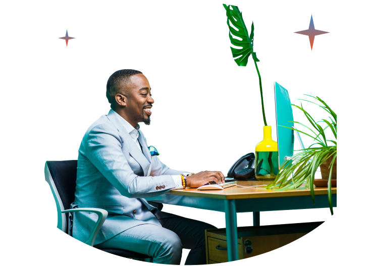 A man working at a desk with a laptop