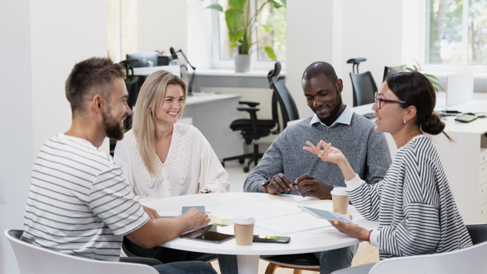 close-up-young-colleagues-having-meeting